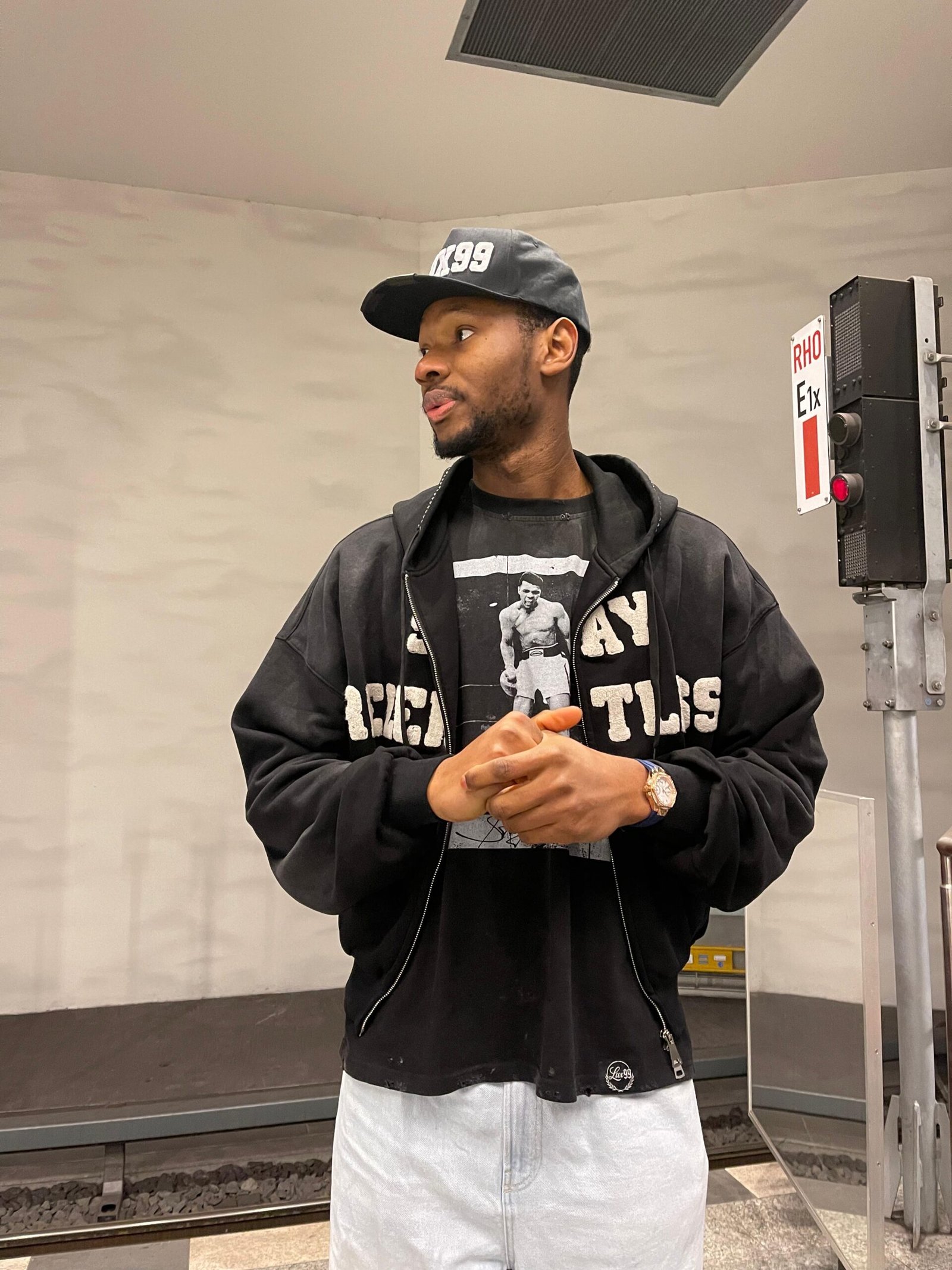 Guy on a black Stay Relentless lux99tm hoodie with a